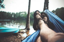 feet in sandals in a hammock 