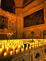 A Church Filled With Lit Candles 