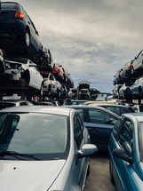 stacked scrap cars. recovery of car components