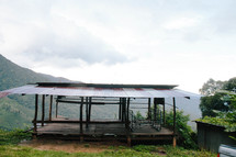 a covered patio looking over a mountain 