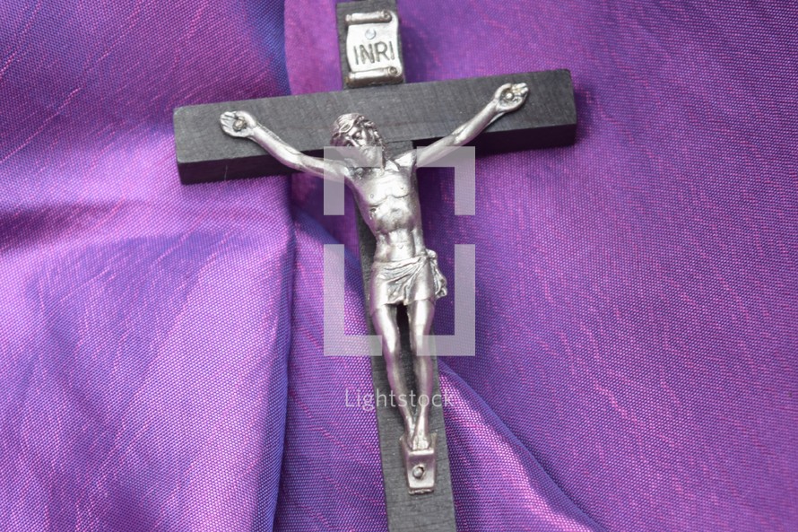 crucifix on purple fabric for Lent 