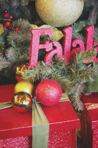 fa la la sign in tree with gifts