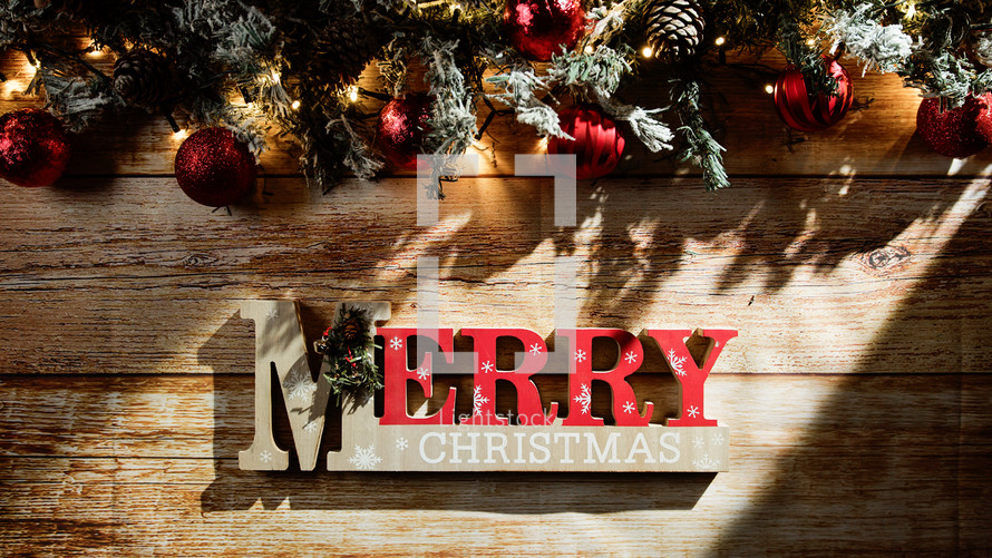 Merry Christmas sign with decorations background