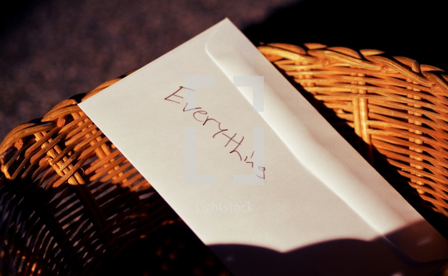 basket with an envelope with the word everything 