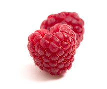 heart shaped Raspberries Isolated on a White Background