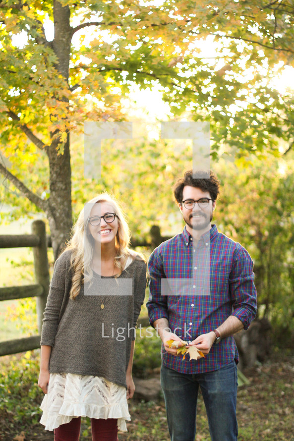 portrait of a couple standing together outdoors 