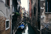 gondolas in a narrow canal in Venice 