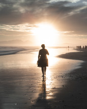 silhouette of a woman on a beach 