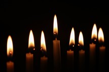 flames from candles in darkness 