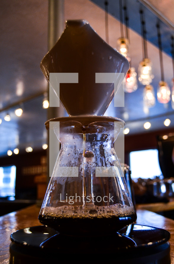 Coffee urn on a bar.