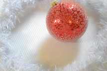 red Christmas ball ornament on white 