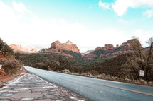 road through a red rock canyon 