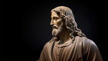 Statue of Jesus Christ isolated on black background with copy space