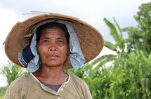 Old Indonesian lady in a straw hat 