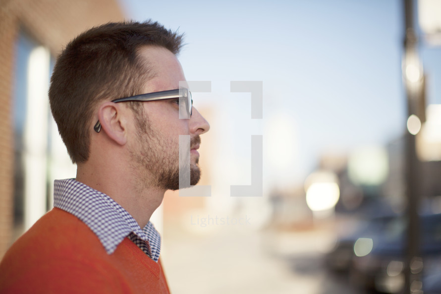 side profile of a man in reading glasses 
