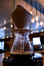 Coffee urn on a bar.