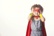 Child dressed as a superhero.