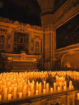 Candles Giving Light To Darkness Inside A Sanctuary 