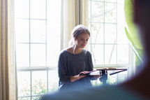 a woman leading a group Bible study discussing scripture 