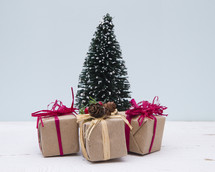 brown paper gifts and bottle brush Christmas tree 