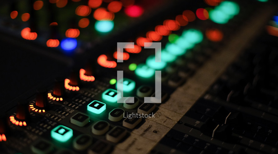 glowing buttons on a soundboards 
