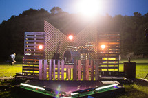 Stage made from pallets and lattice for a band.