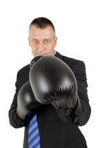 a businessman wearing boxing gloves 