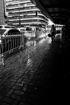 walking on a covered sidewalk in the rain 