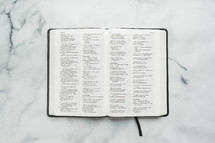 overhead view of Bible pages on a table