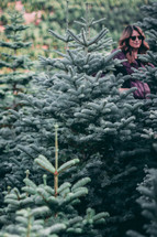 woman at a Christmas tree farm 