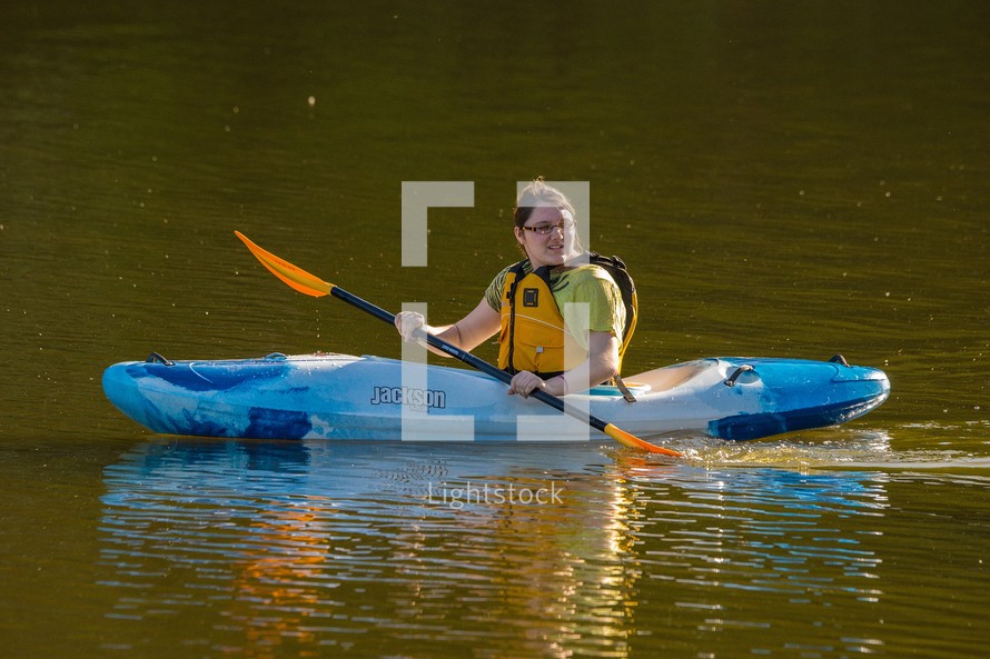 Fifteen year old girl in kayak on City Lake, Albemarle, North Carolina 
