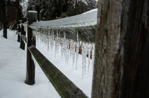 icicles on a fence rail