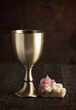 The Sacrament of Holy Communion on a Dark Wooden Table