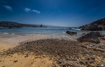 tide washing onto a rocky beach 