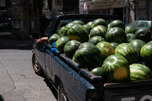 watermelon in the back of a truck 