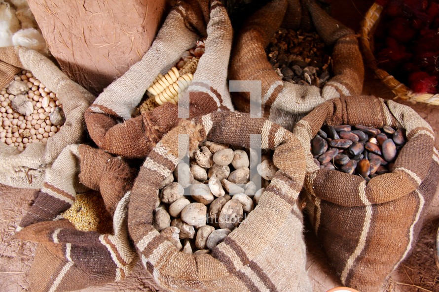 sacks of grains, nuts, and spices 