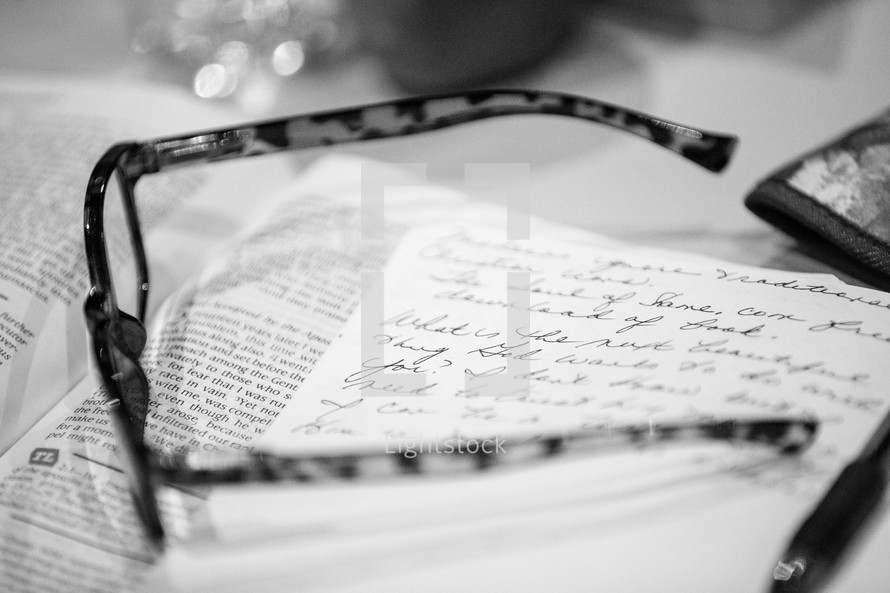 reading glasses on journal and Bible 