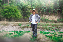 a man standing in a farm 