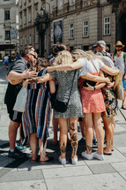 Group of people praying before evangelising 