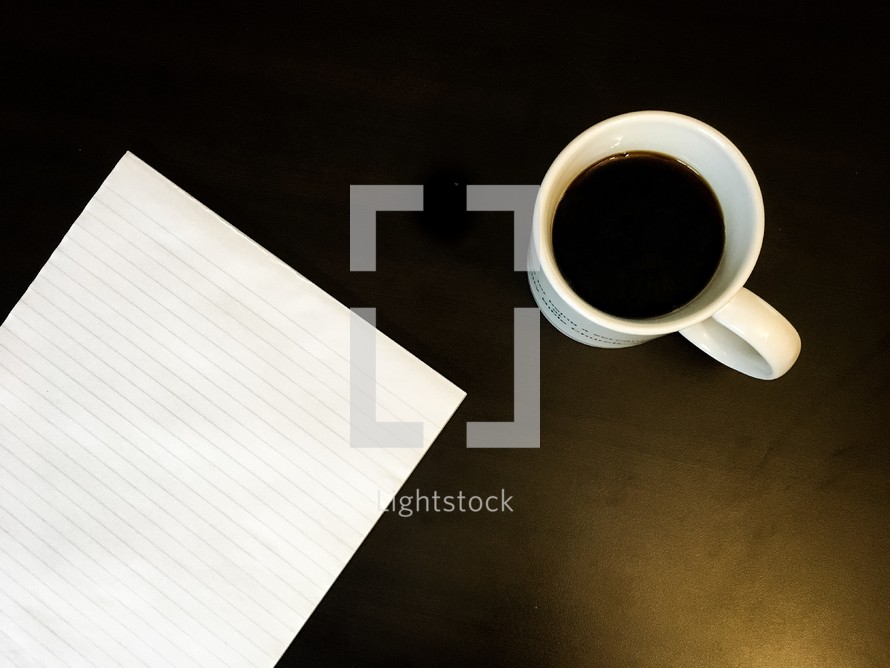 coffee mug and blank lined paper 