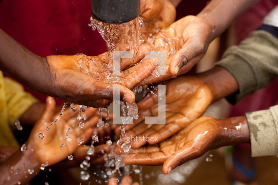 washing hands with clean water in Africa 