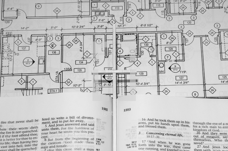 blueprints and an open Bible 