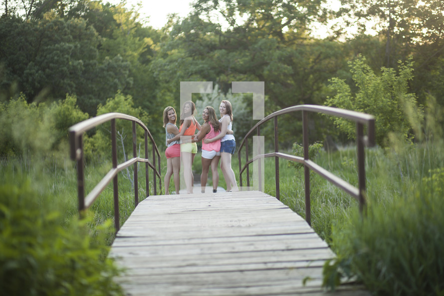 portrait of teen girls on a bridge