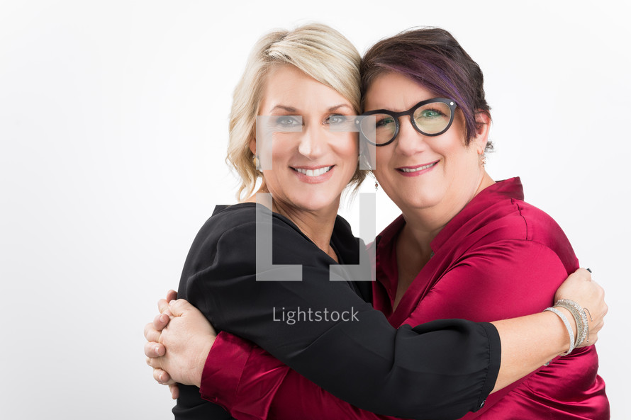 two women hugging 