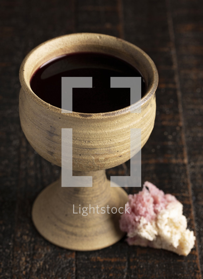 The Sacrament of Holy Communion on a Dark Wooden Table