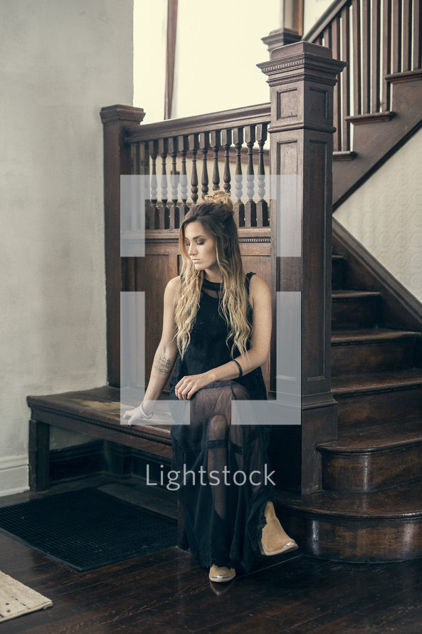 model posing near a staircase 