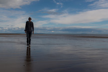 man walking on a beach 