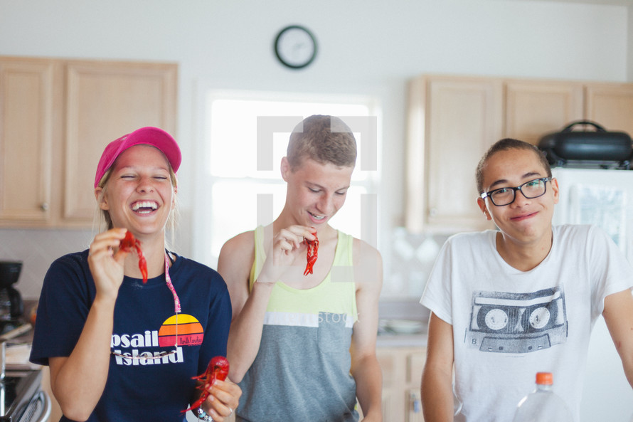 teens with candy in a kitchen 