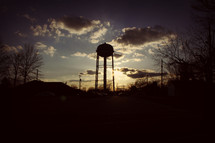 silhouette of a water tower at sunset 