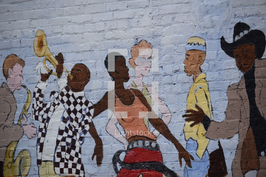 Jazz band and dancers street art painted on a brick wall 